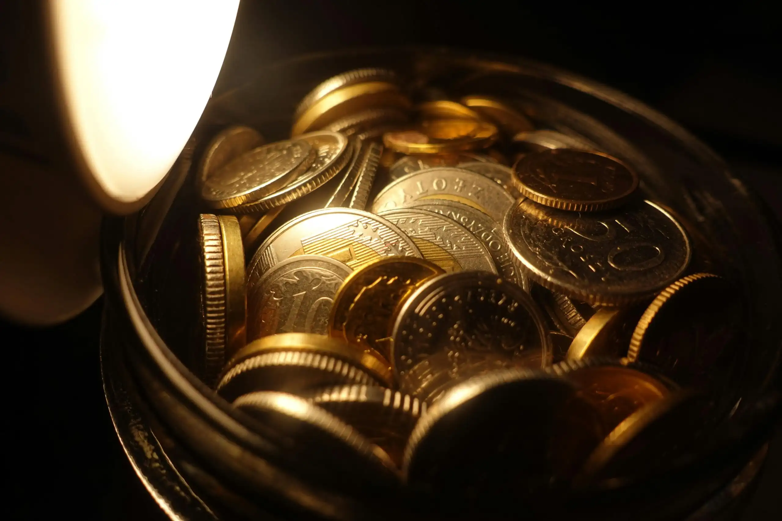 A jar full of gold coins, representing how a Freelance Digital Marketing Strategist in Kochi helps clients optimize their marketing budget for better ROI.